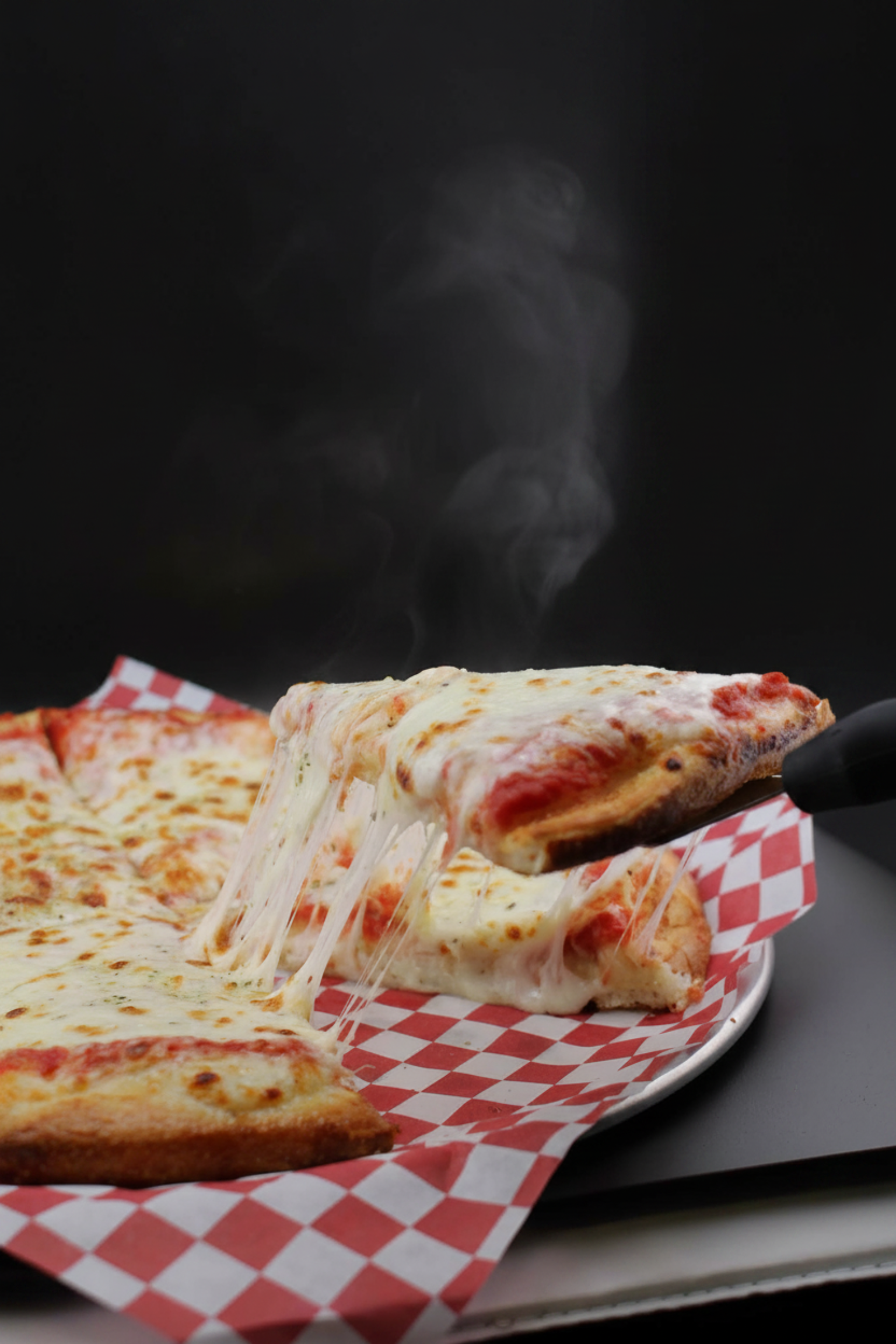 $3 hot pizza slices and cheese pull from Pizza Meltdown
